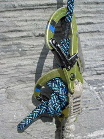 The karabiners of my via ferrata lanyards clipped just above the knot at the end of one of the ropes on the descent from the Rotstock.