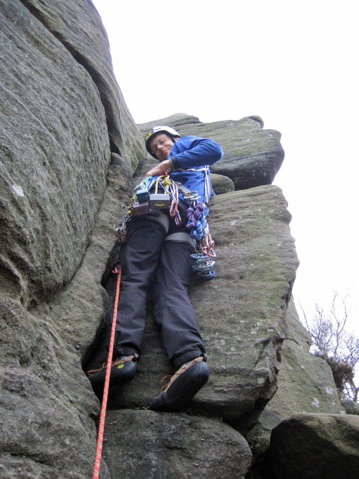 Me climbing Cracked Corner (VD, 3c) at Brimham Rocks.