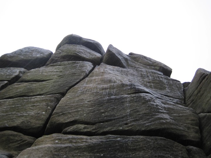 Rain trickling down Cracked Buttress at Brimham Rocks.