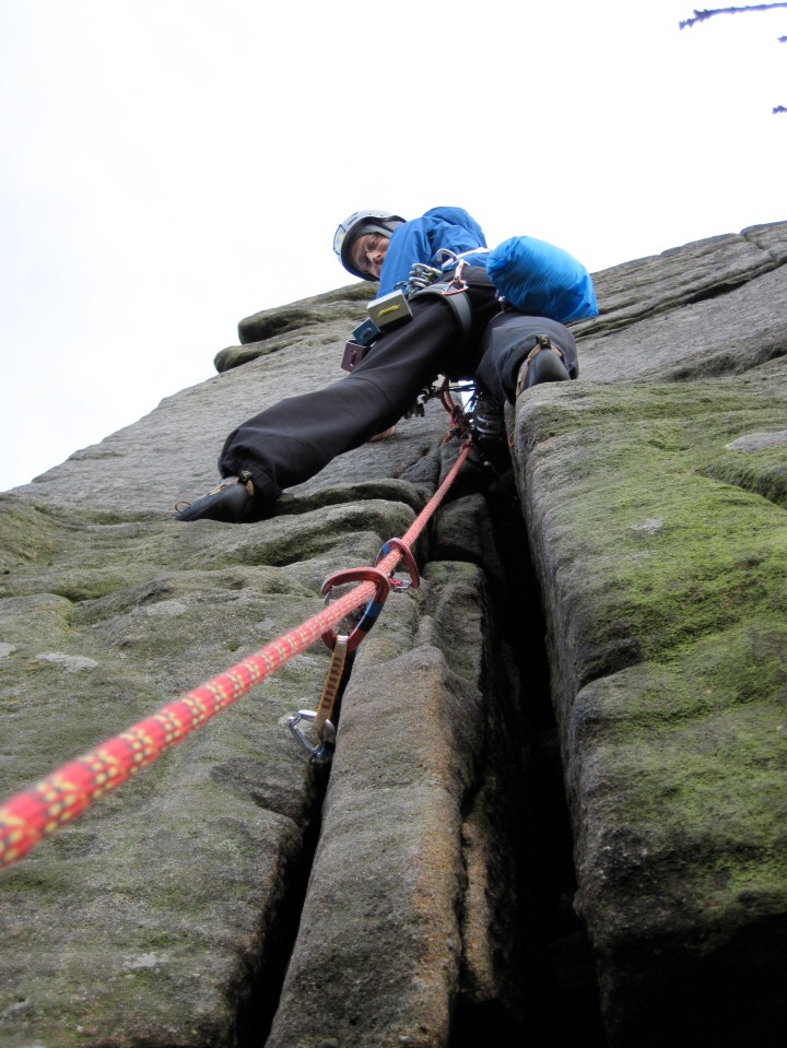 Me climbing Wobblestone Crack at Burbage in the Peak District.