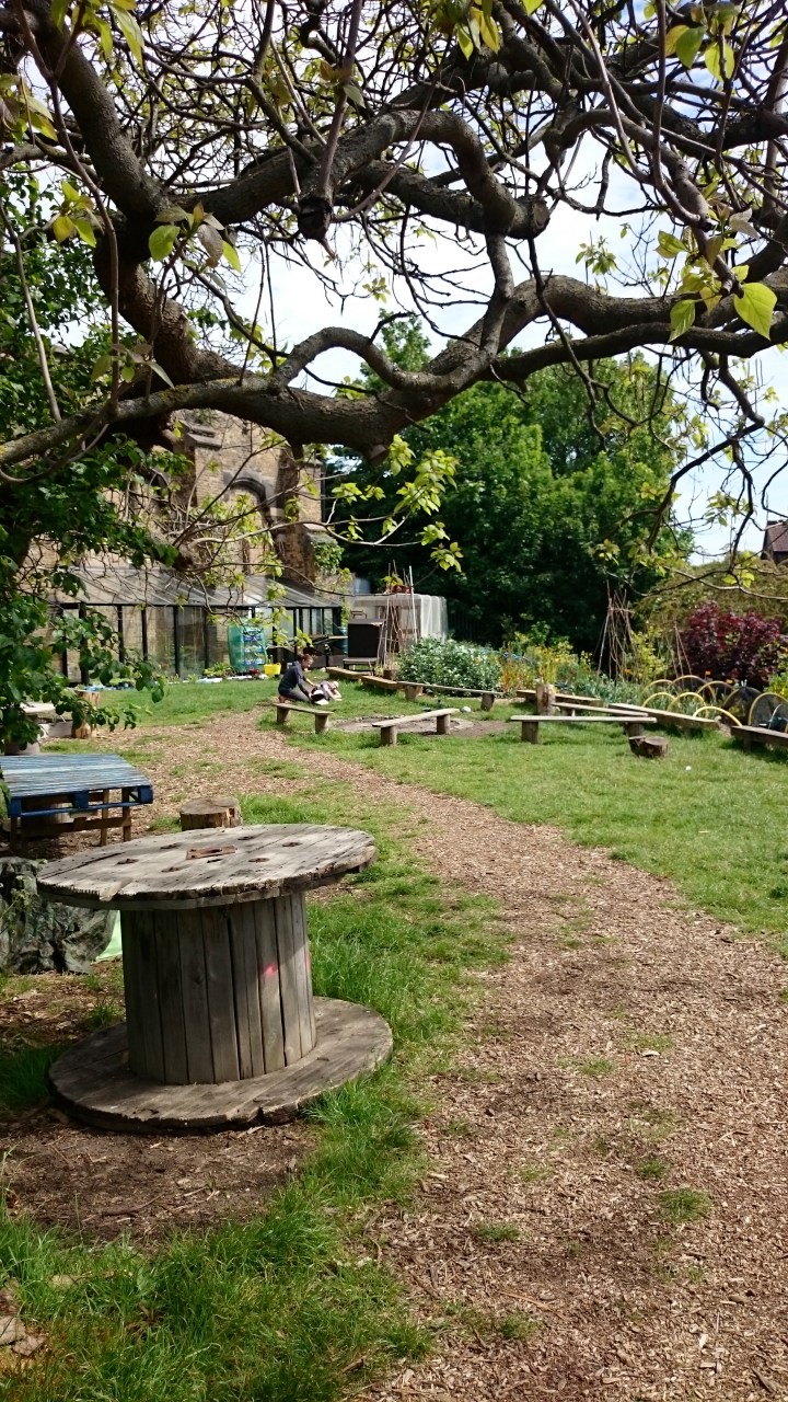 Alice showing me exercises in the garden of the climbing wall.