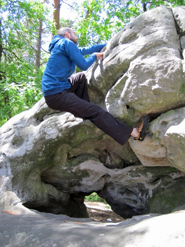 Me climbing problem orange 12 at Buthiers Piscine in the forests of Fontainebleau.